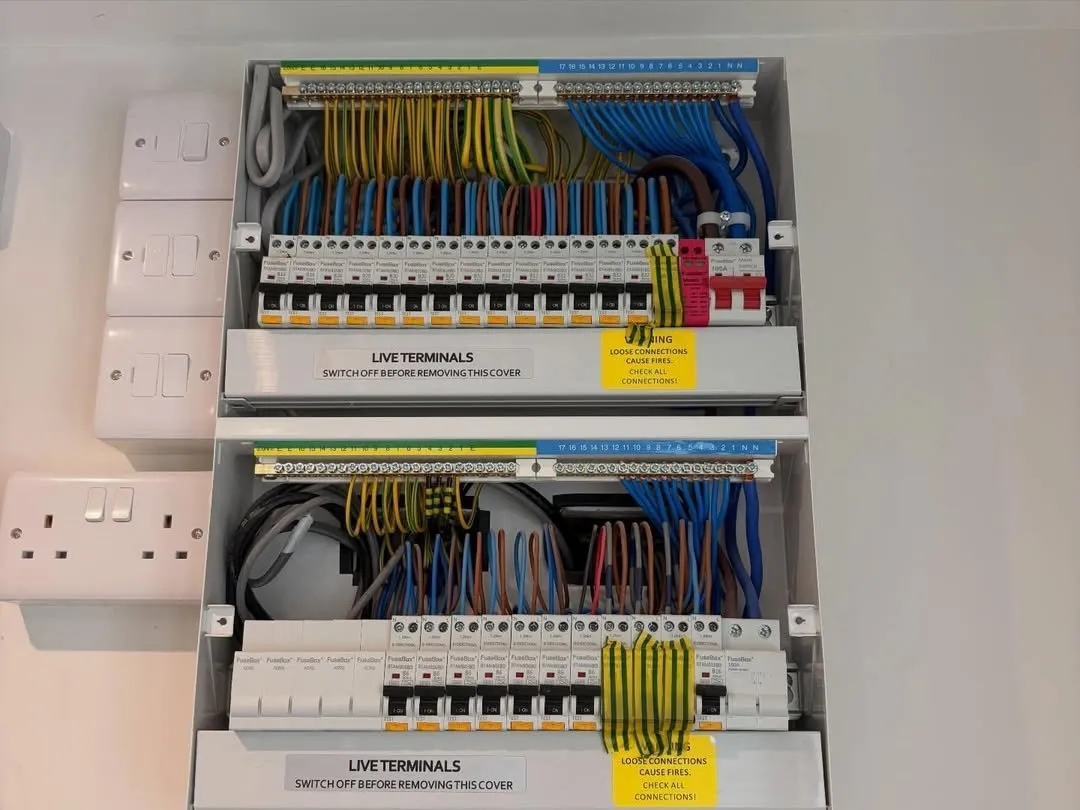 Two newly installed consumer units with neatly dressed cabling