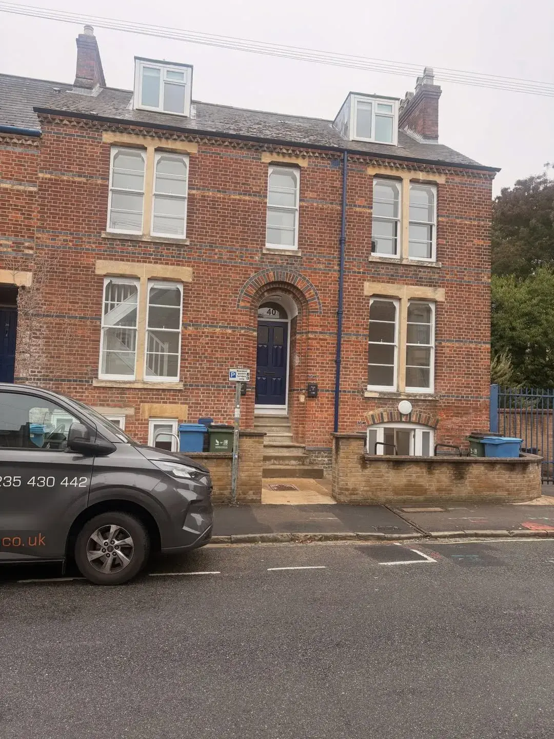 Adtec van outside a large Victorian brick property during a flat conversion